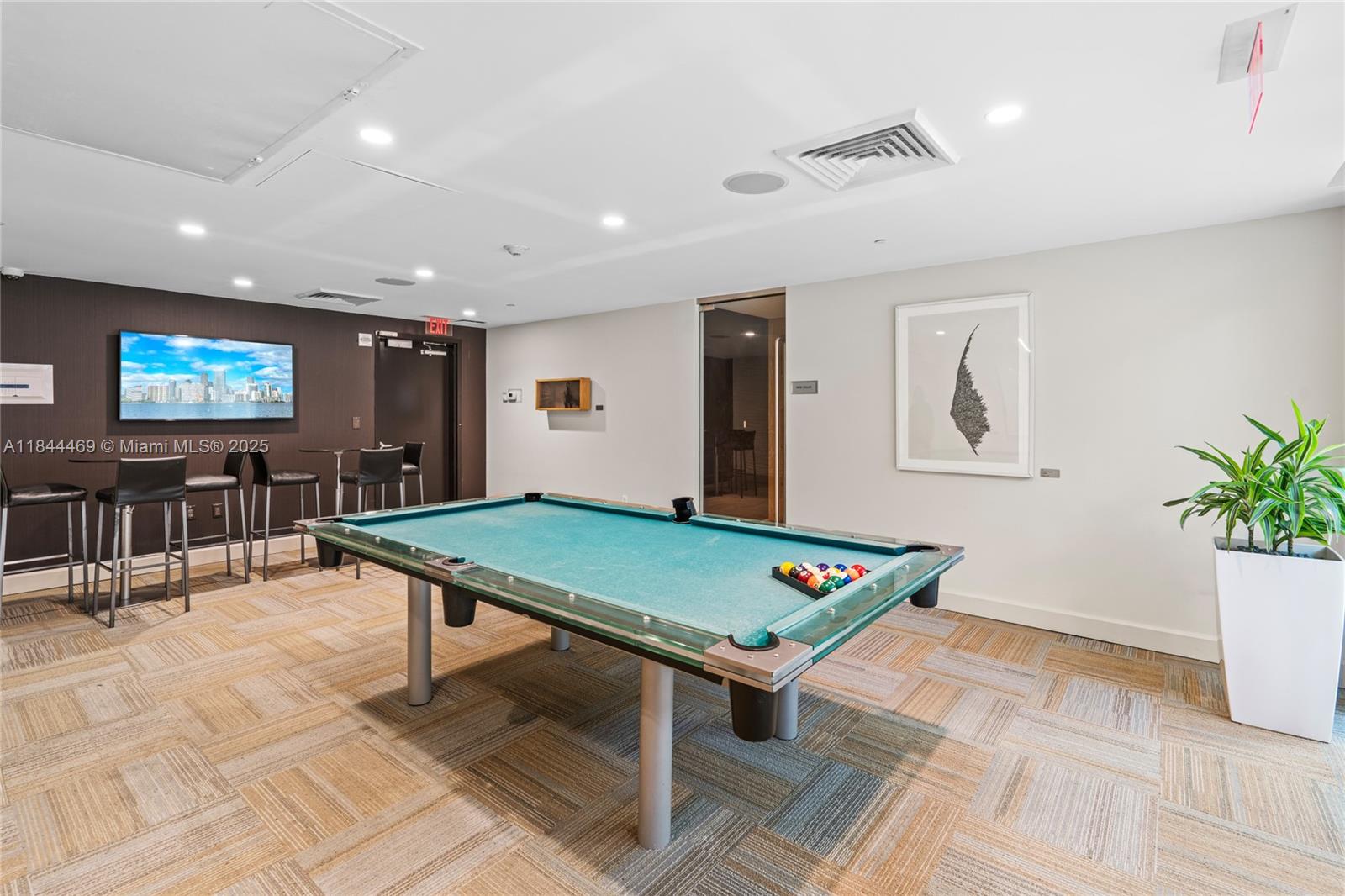 951 Brickell Avenue, Unit 1505 Miami, FL 33131 - Photo 44 of 48 a room with pool table and windows