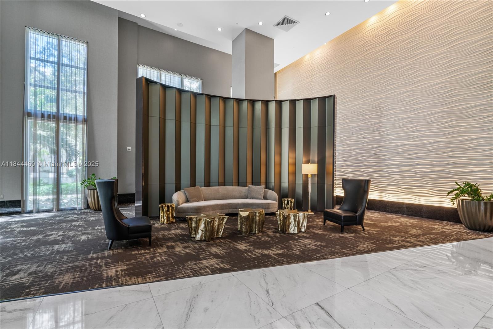 951 Brickell Avenue, Unit 1505 Miami, FL 33131 - Photo 47 of 48 a living room with a couch chair and a window