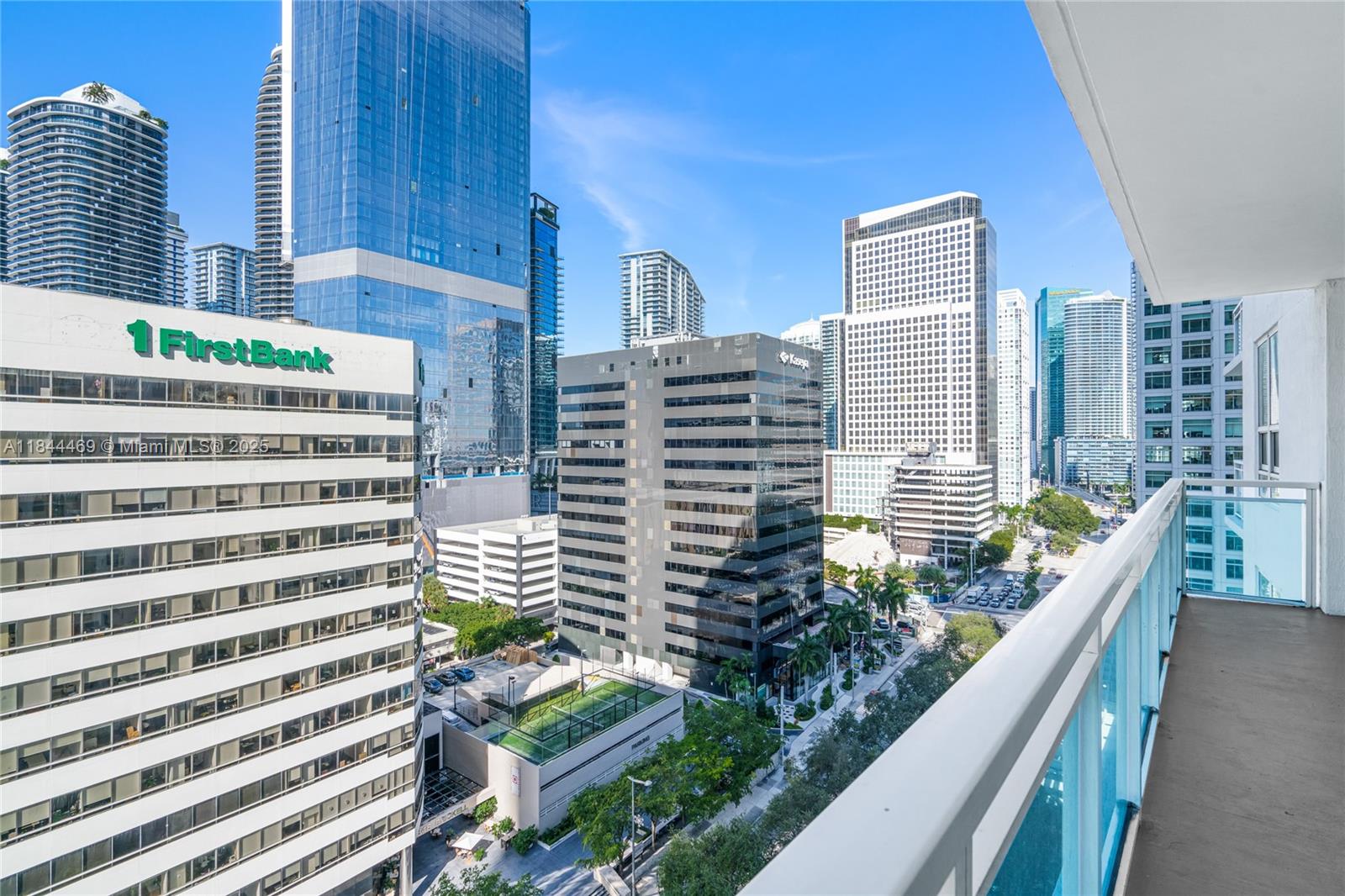 951 Brickell Avenue, Unit 1505 Miami, FL 33131 - Photo 9 of 48 a view of balcony with wooden floor and fence