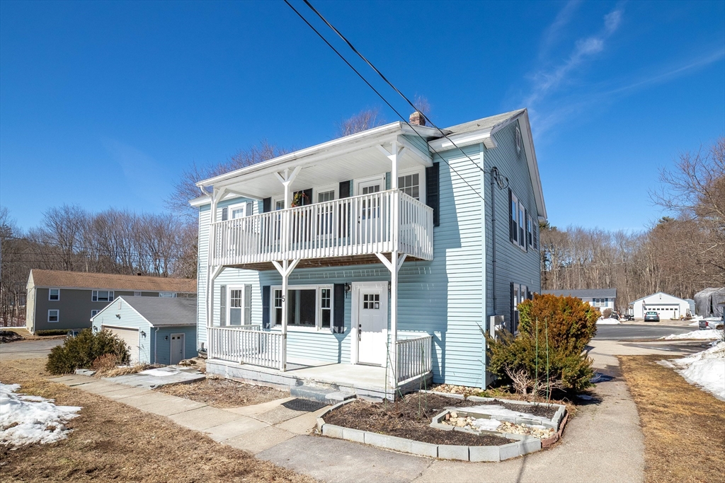 5 Maple Avenue, Unit 2 Oxford, MA 01537 - Photo 2 of 22 a front view of a house with garden