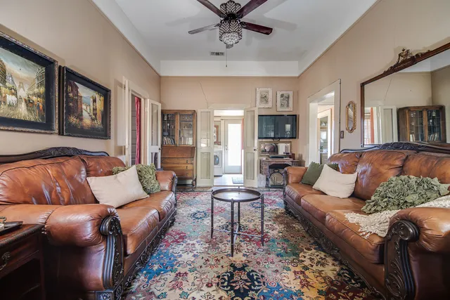 a living room with furniture and a fireplace