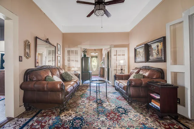 a living room with furniture and a rug
