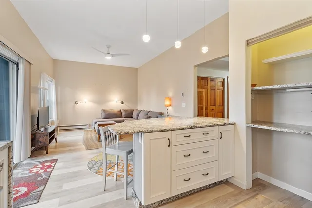 a kitchen with a stove a refrigerator and a sink