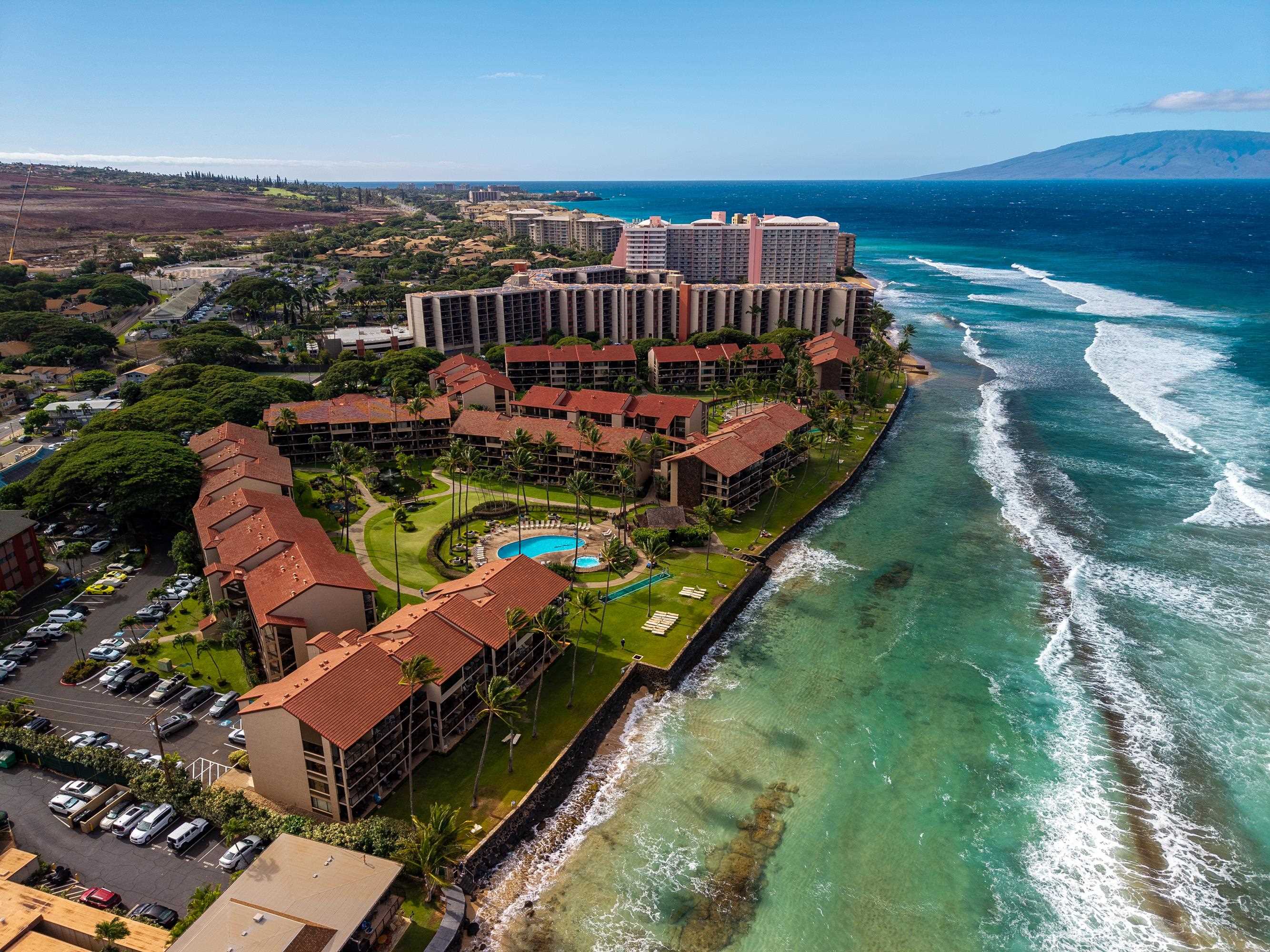 an aerial view of a house with garden space ocean view