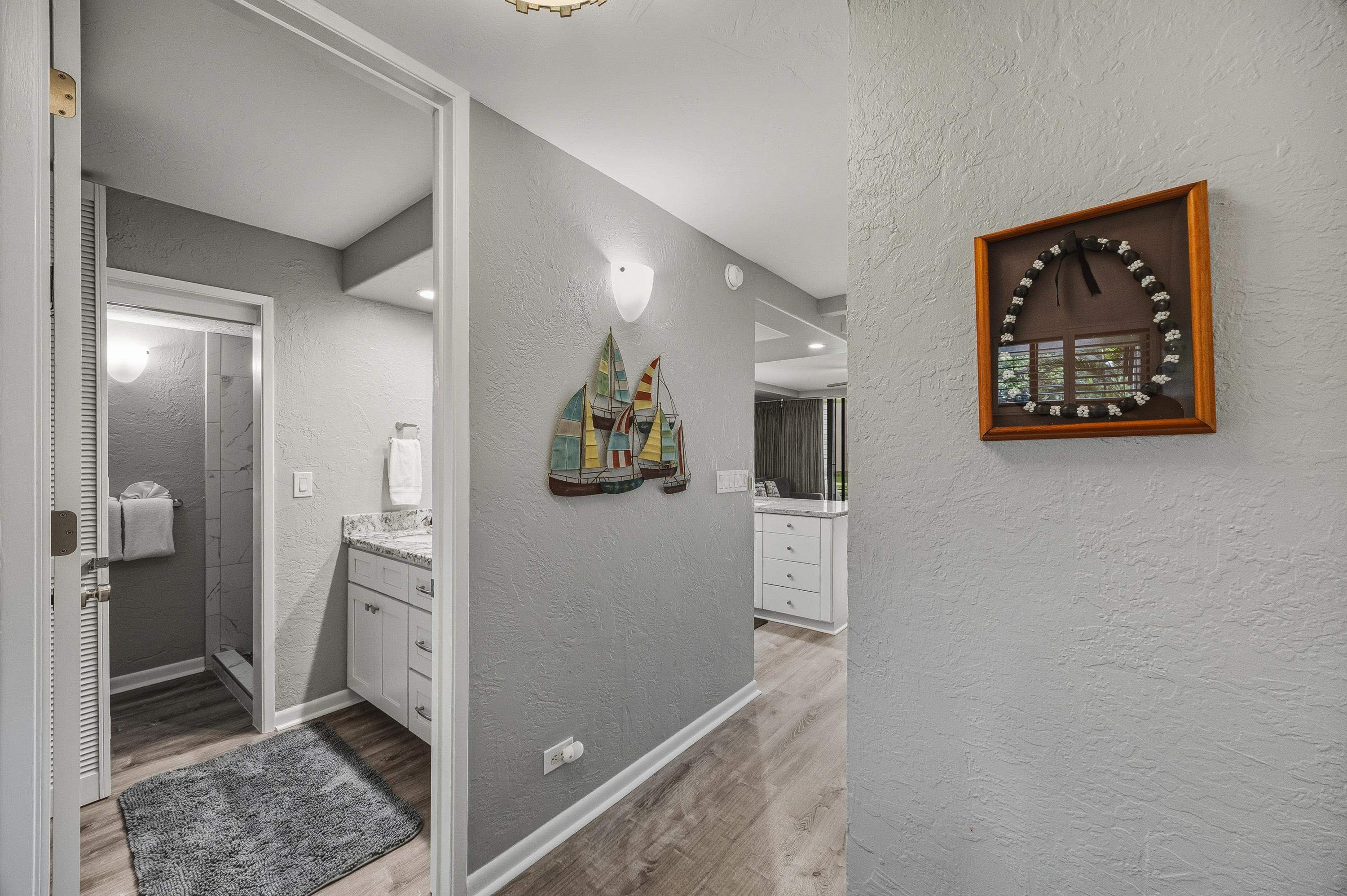 3543 Lower Honoapiilani Road, Unit H103 Lahaina, HI 96761 - Photo 12 of 50 a view of a hallway with closet and bathroom