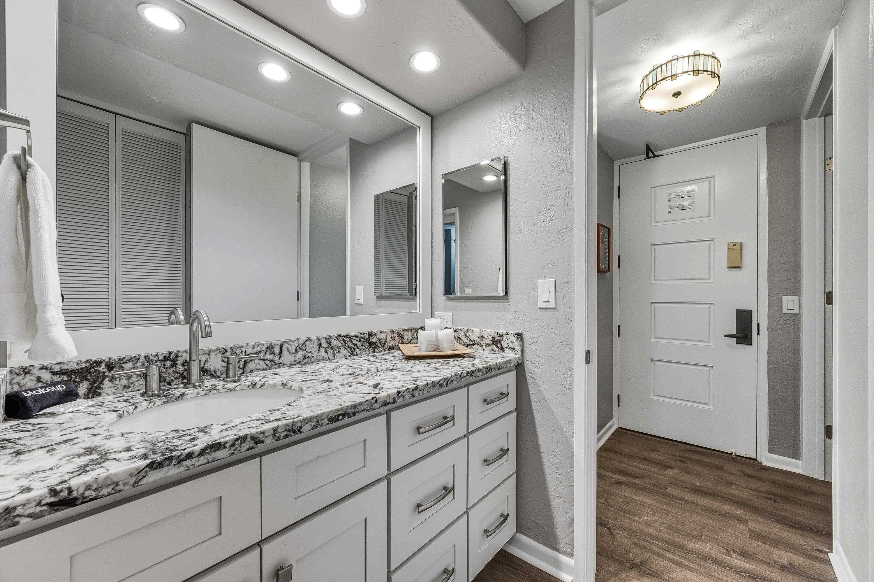 3543 Lower Honoapiilani Road, Unit H103 Lahaina, HI 96761 - Photo 18 of 50 a bathroom with a granite countertop sink mirror and double