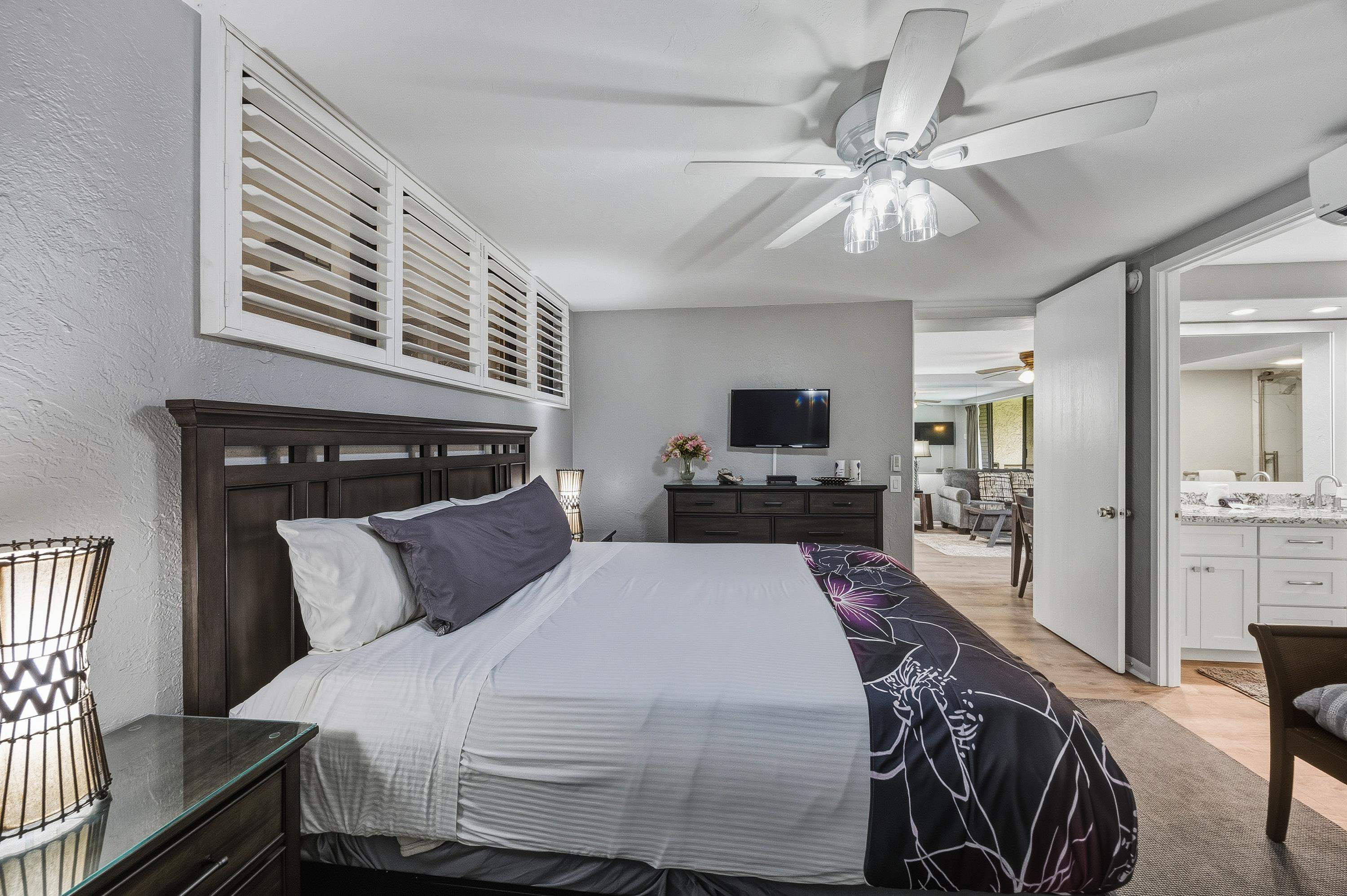 3543 Lower Honoapiilani Road, Unit H103 Lahaina, HI 96761 - Photo 27 of 50 a bedroom with a bed and a flat screen tv