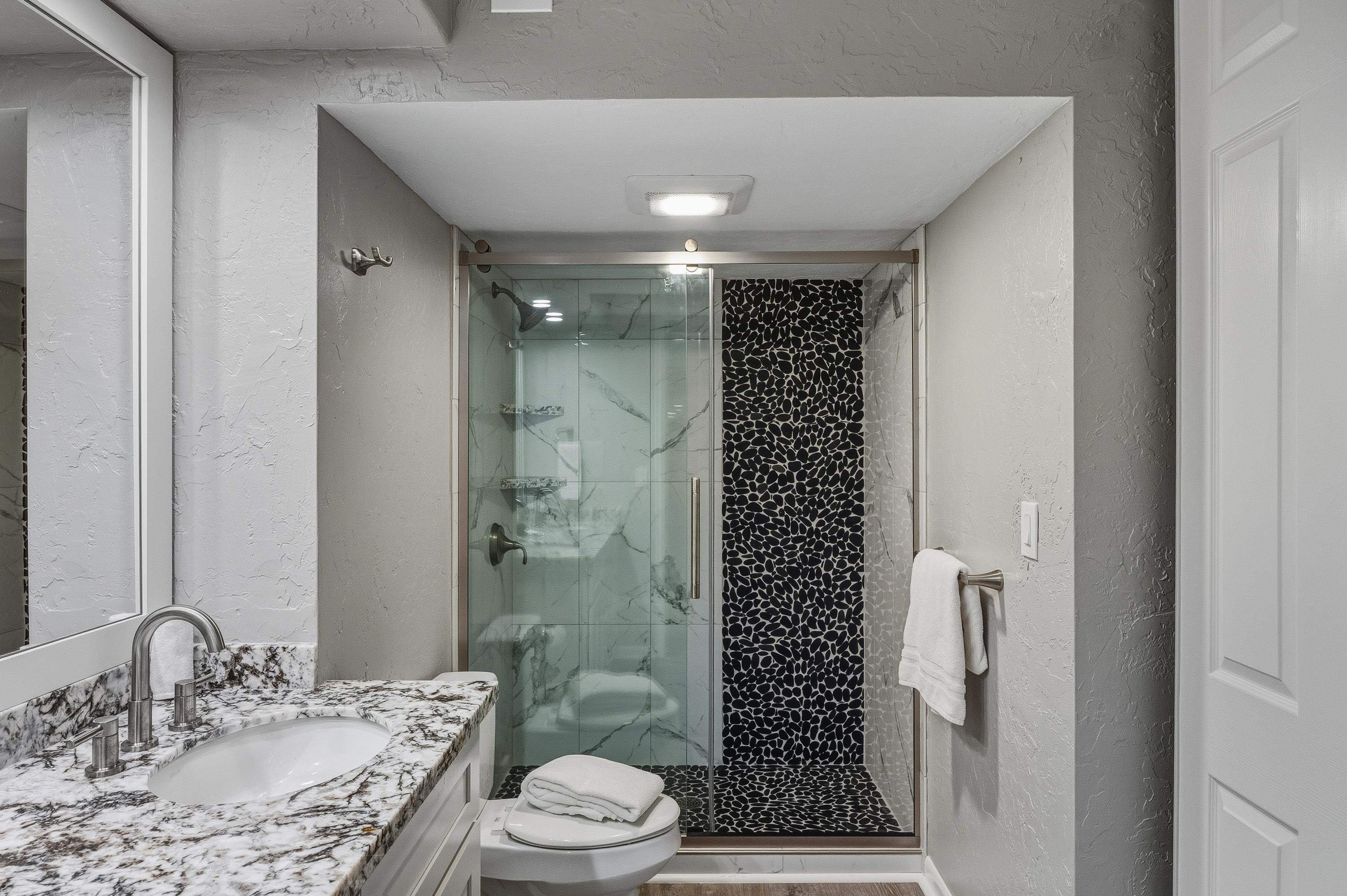 3543 Lower Honoapiilani Road, Unit H103 Lahaina, HI 96761 - Photo 31 of 50 a bathroom with a granite countertop sink toilet and shower