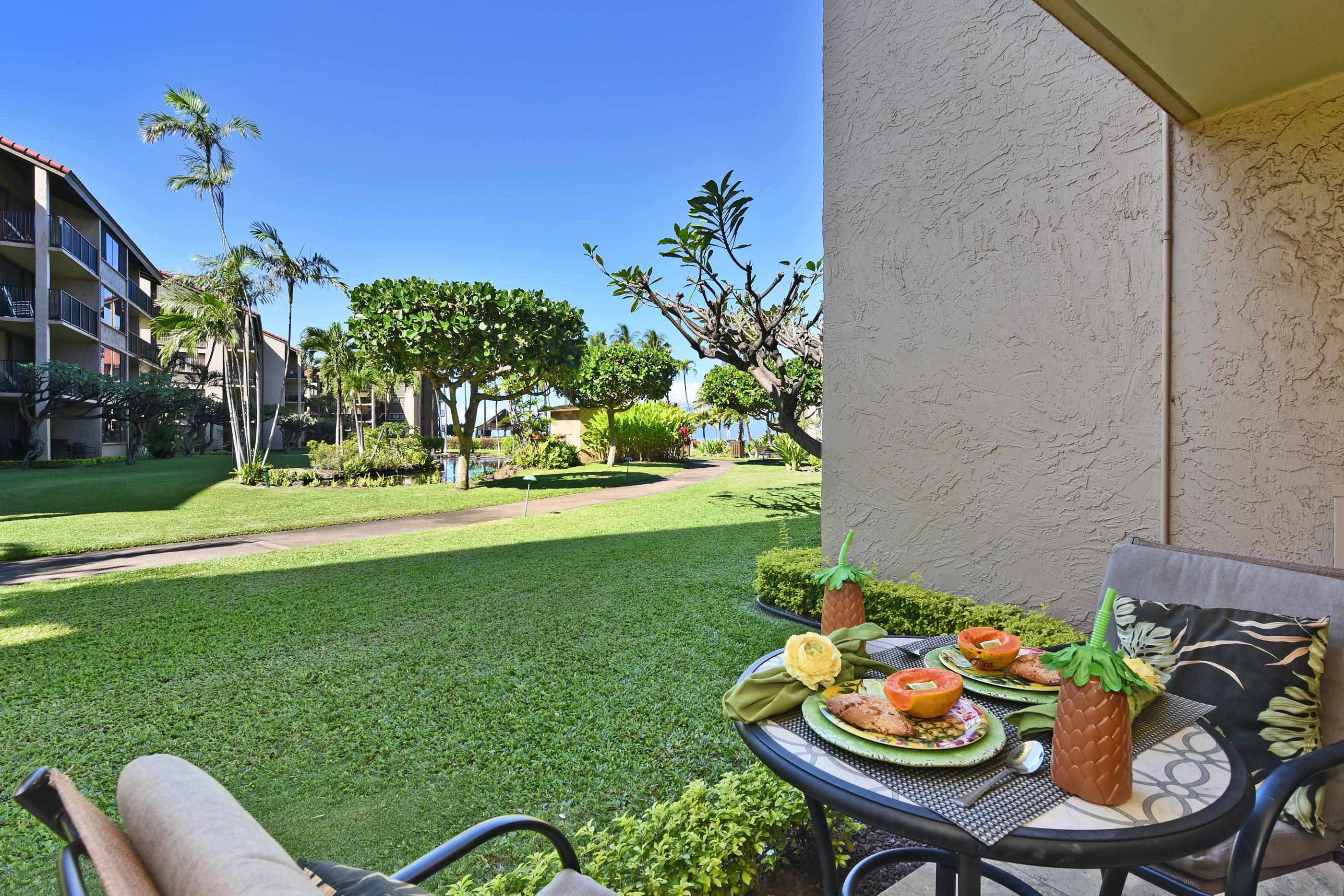 3543 Lower Honoapiilani Road, Unit H103 Lahaina, HI 96761 - Photo 34 of 50 a outdoor dining space with furniture and garden