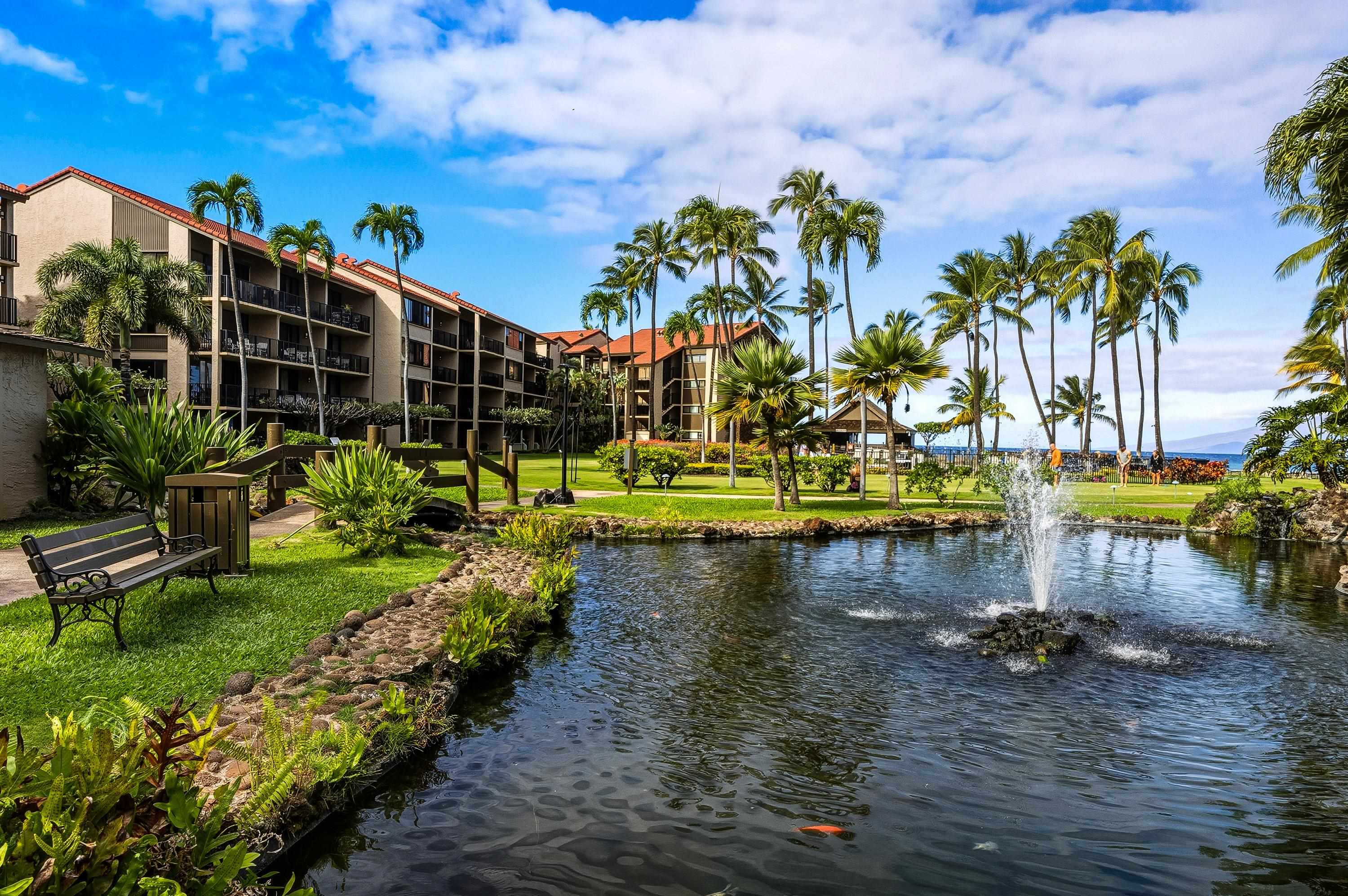3543 Lower Honoapiilani Road, Unit H103 Lahaina, HI 96761 - Photo 39 of 50 a view of a lake with a building in the background
