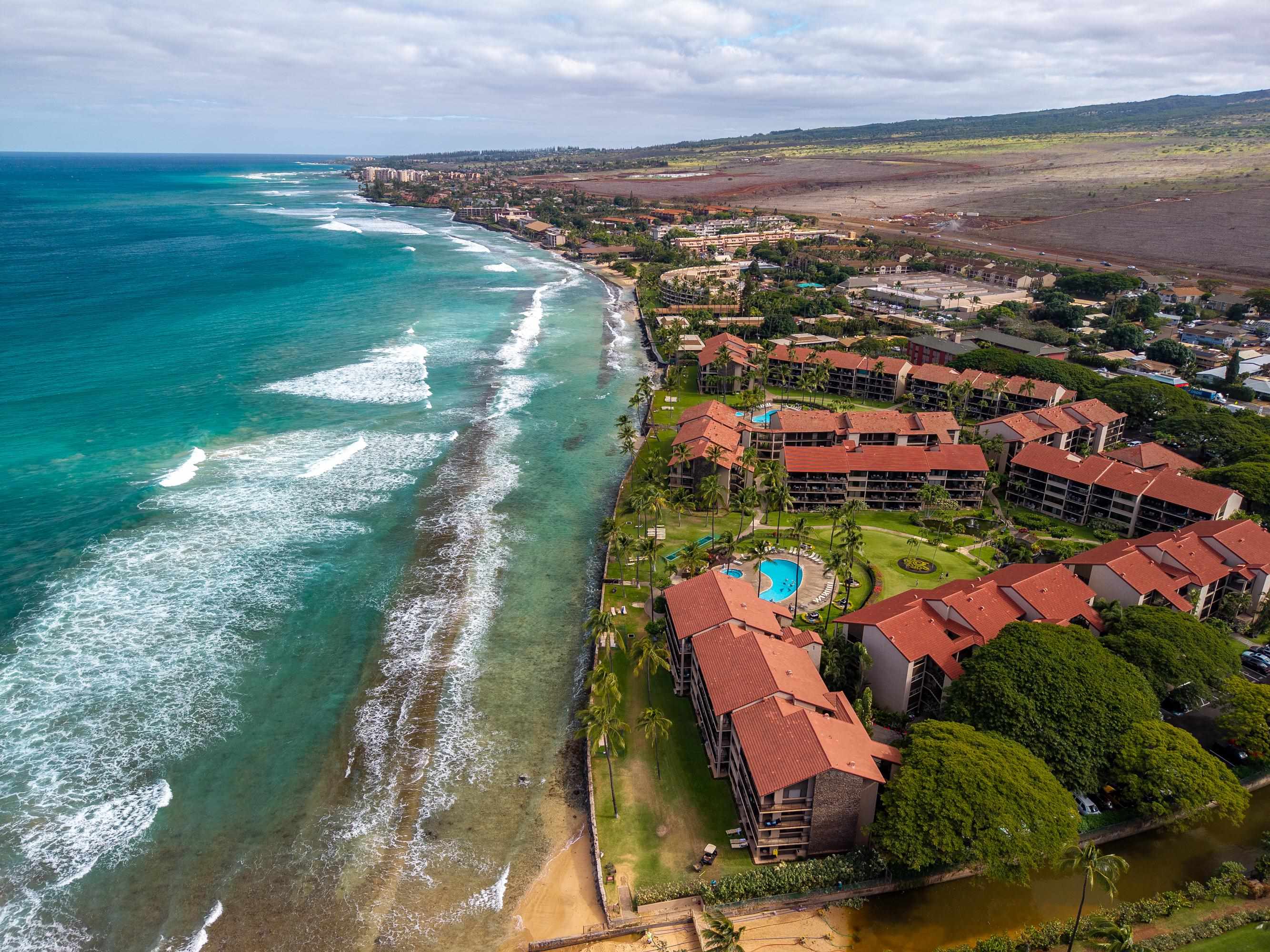 3543 Lower Honoapiilani Road, Unit H103 Lahaina, HI 96761 - Photo 44 of 50 an aerial view of residential houses with outdoor space and swimming pool