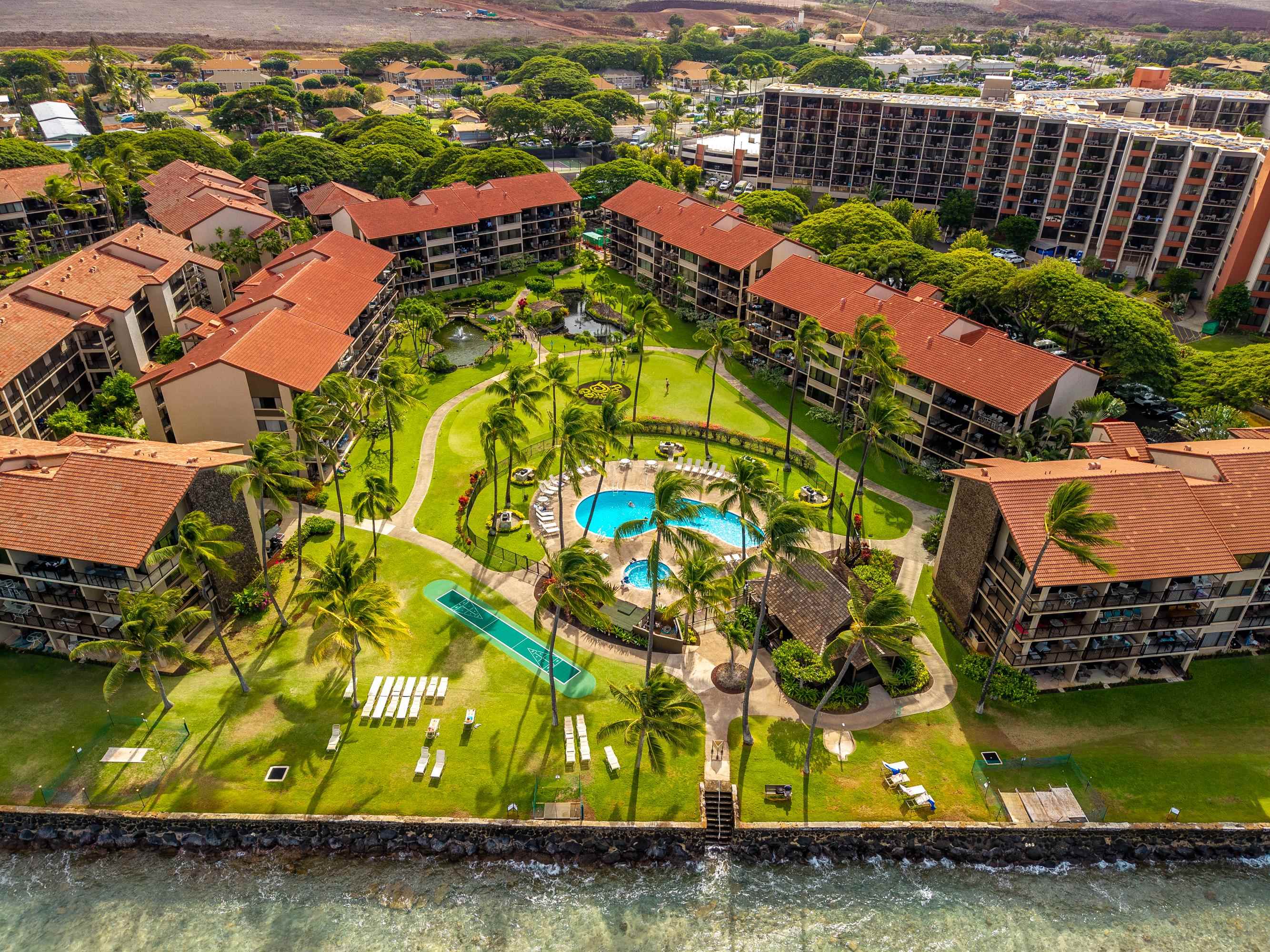 3543 Lower Honoapiilani Road, Unit H103 Lahaina, HI 96761 - Photo 48 of 50 an aerial view of residential houses with outdoor space and swimming pool