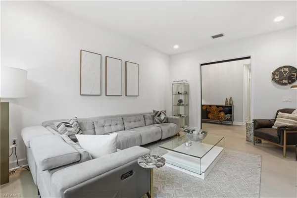 a living room with furniture and a table