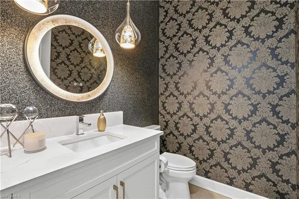 a bathroom with a toilet and a sink