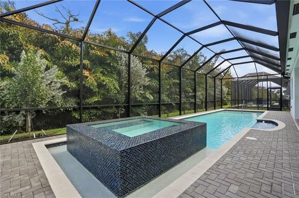a view of swimming pool with a balcony