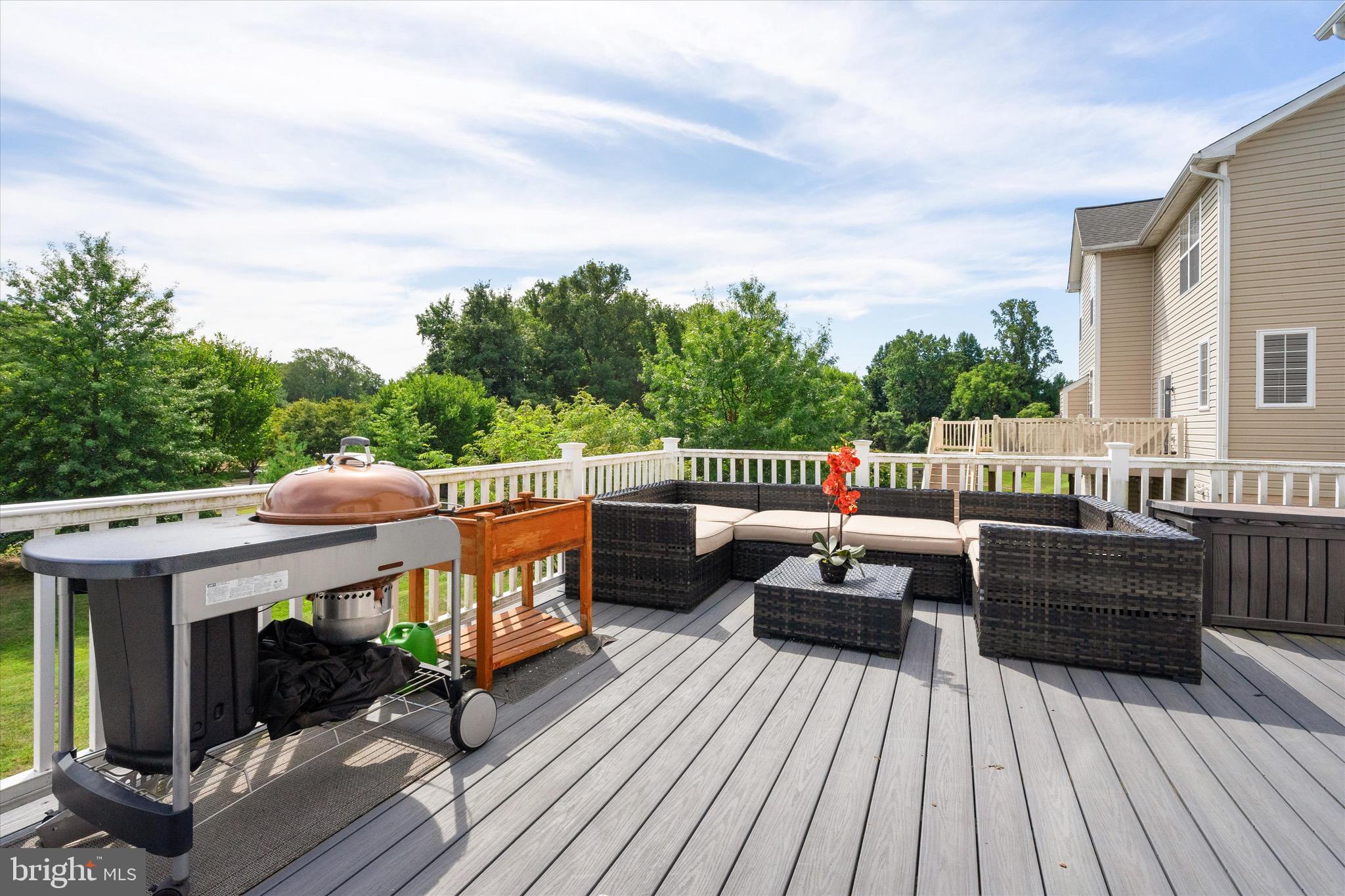 9817 Traver Street Bowie, MD 20721 - Photo 4 of 23 Massive Deck: Cooking Area and Seating Space