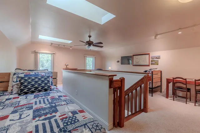 a living room with lots of furniture and window
