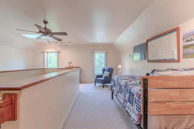 a bed room with a bed and a chandelier