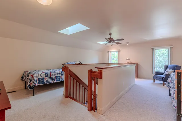 a view of a livingroom with furniture and windows