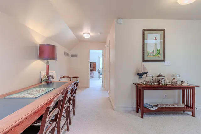 a view of a workspace with furniture