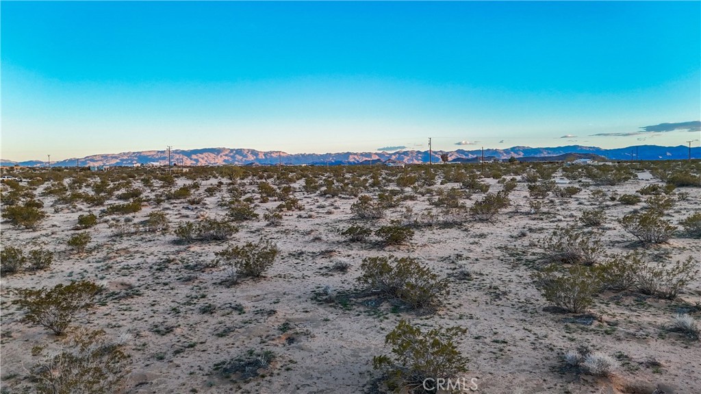 0 Cypress Rd. Road Joshua Tree, CA 92252 - Photo 31 of 33 a view of a large body of water with a building in the background