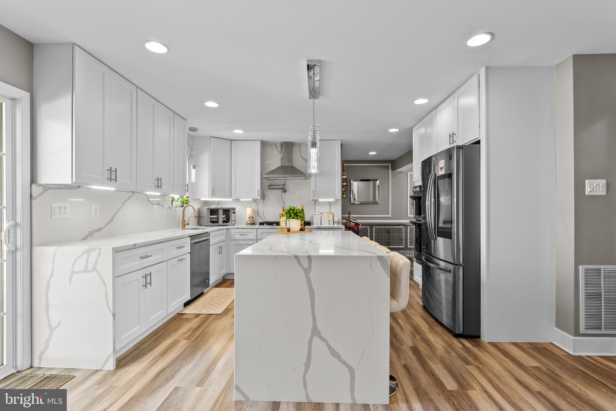 1735 Canal Run Drive Point of Rocks, MD 21777 - Photo 19 of 59 a kitchen with kitchen island a sink stainless steel appliances and refrigerator