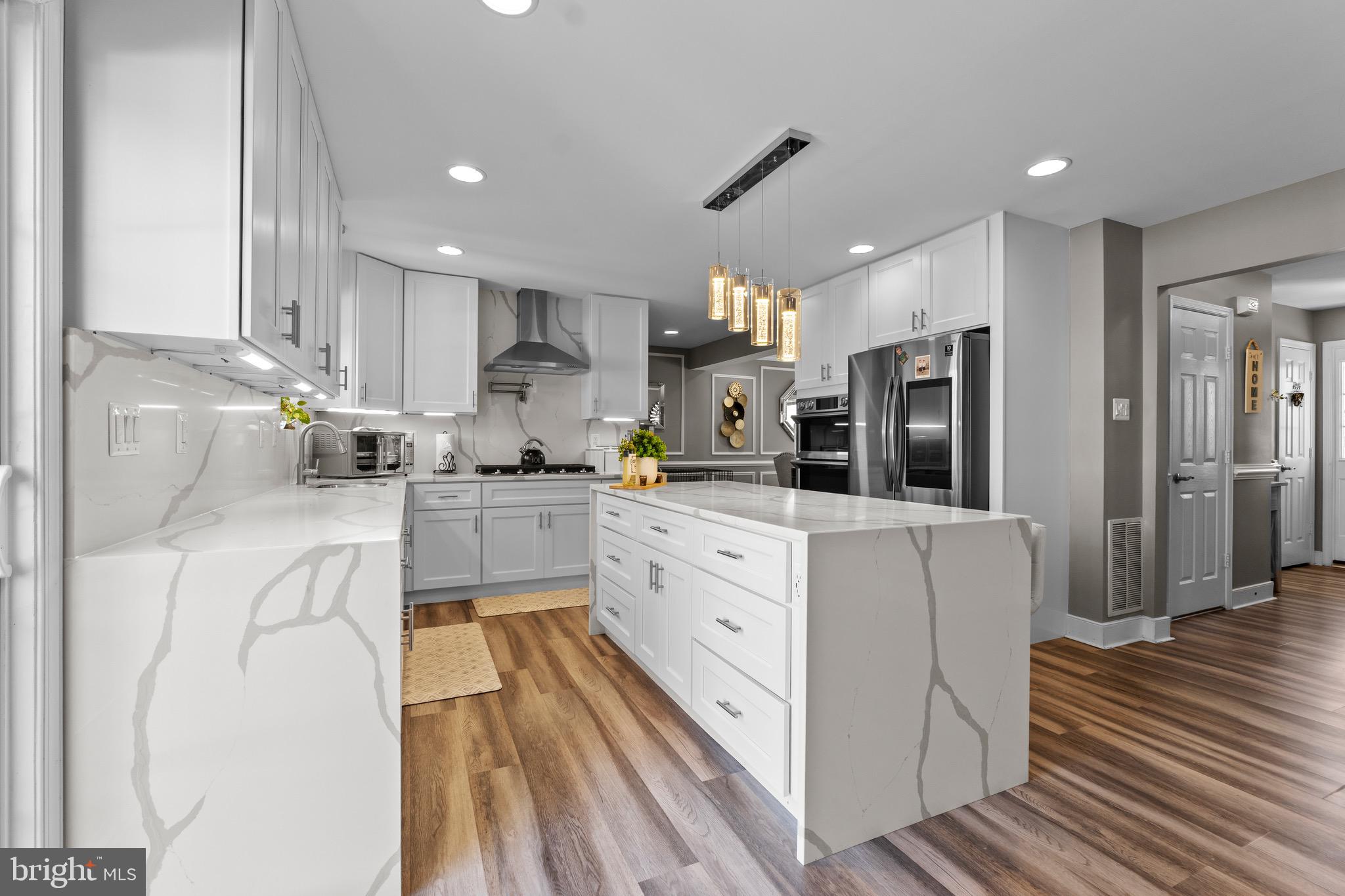 1735 Canal Run Drive Point of Rocks, MD 21777 - Photo 20 of 59 a kitchen with white cabinets and refrigerator