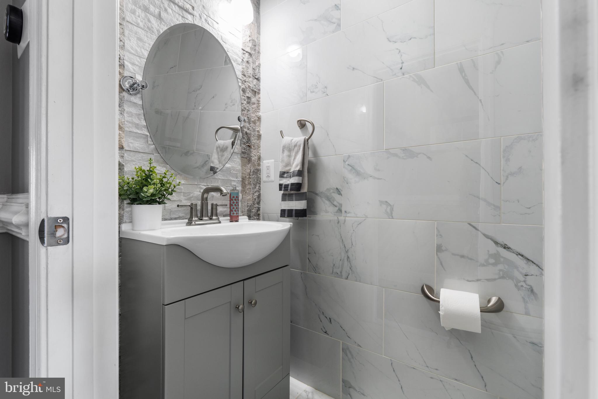 1735 Canal Run Drive Point of Rocks, MD 21777 - Photo 23 of 59 a bathroom with a sink a toilet and mirror