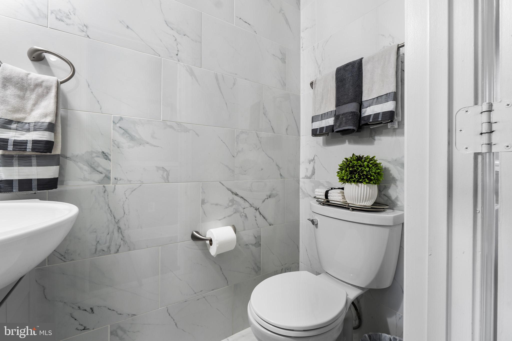 1735 Canal Run Drive Point of Rocks, MD 21777 - Photo 24 of 59 a white toilet sitting next to a bathroom sink