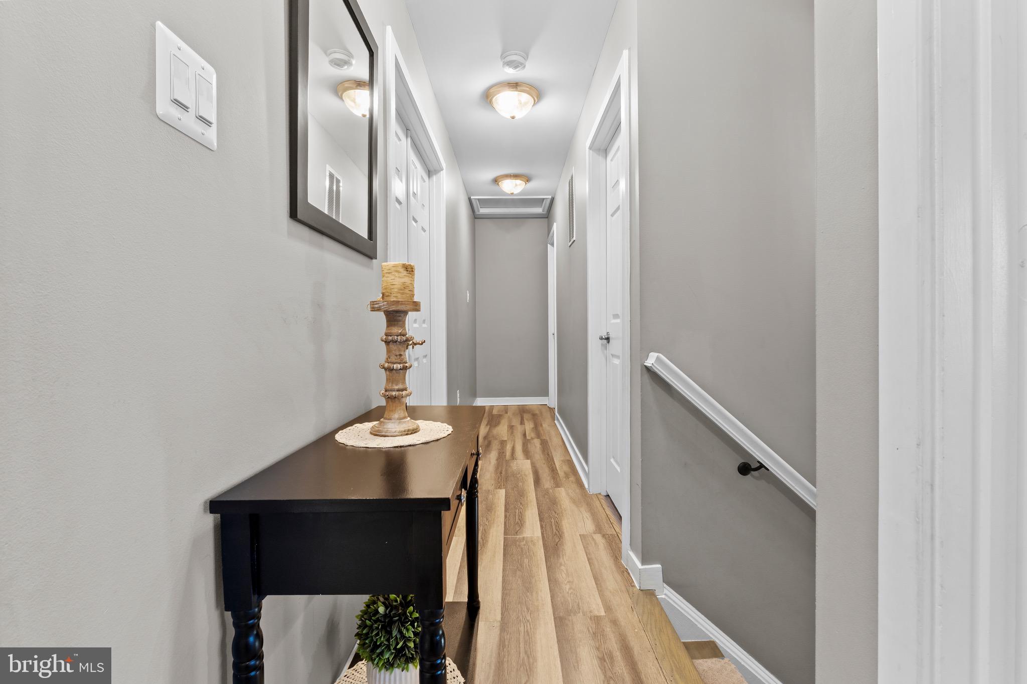 1735 Canal Run Drive Point of Rocks, MD 21777 - Photo 25 of 59 a view of a hallway with wooden floor and staircase