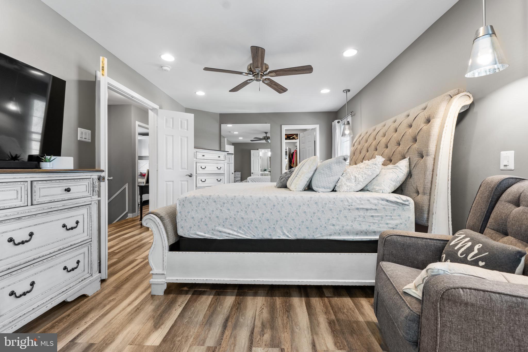 1735 Canal Run Drive Point of Rocks, MD 21777 - Photo 28 of 59 a bedroom with a large bed and a flat screen tv