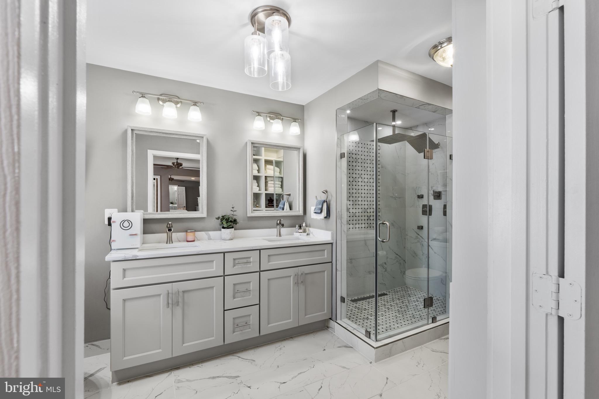 1735 Canal Run Drive Point of Rocks, MD 21777 - Photo 31 of 59 a bathroom with a double vanity sink mirror and shower
