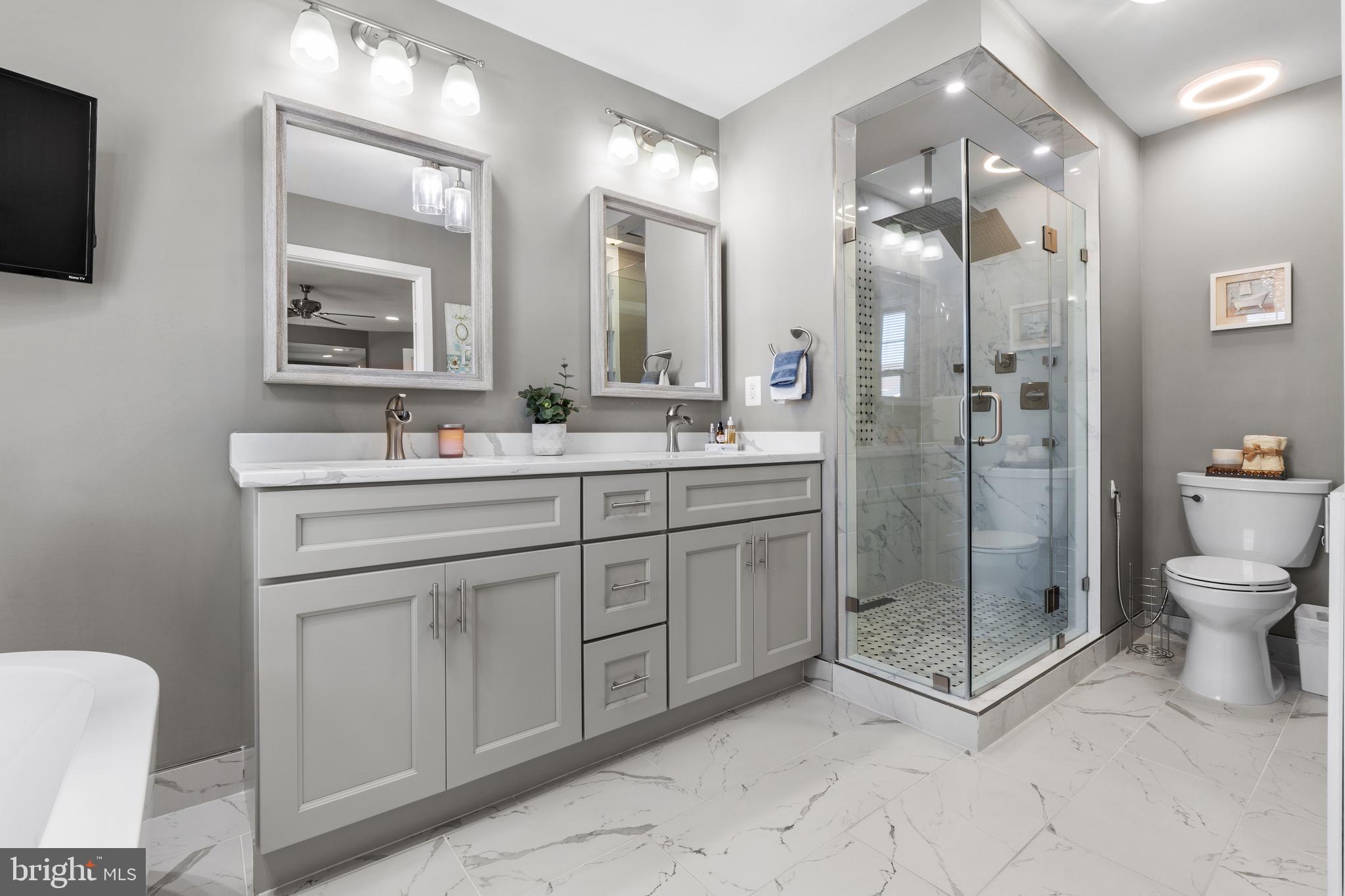 1735 Canal Run Drive Point of Rocks, MD 21777 - Photo 34 of 59 a spacious bathroom with a shower sink mirror and toilet