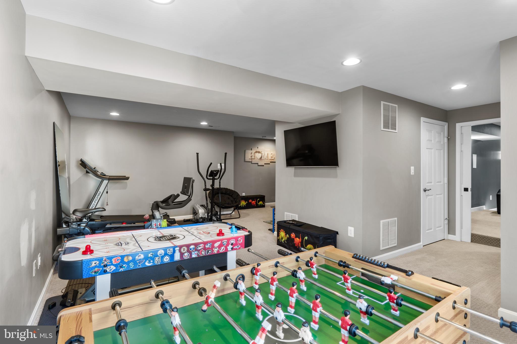 1735 Canal Run Drive Point of Rocks, MD 21777 - Photo 44 of 59 a room with furniture a flat screen tv and a table