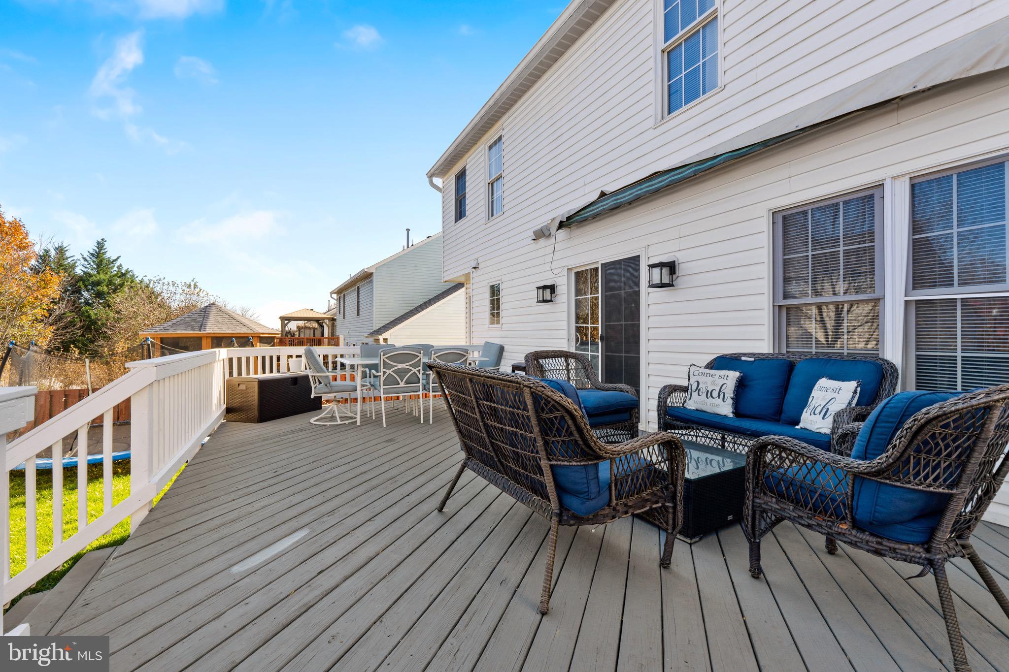 1735 Canal Run Drive Point of Rocks, MD 21777 - Photo 55 of 59 a view of a roof deck with table and chairs with wooden floor and fence