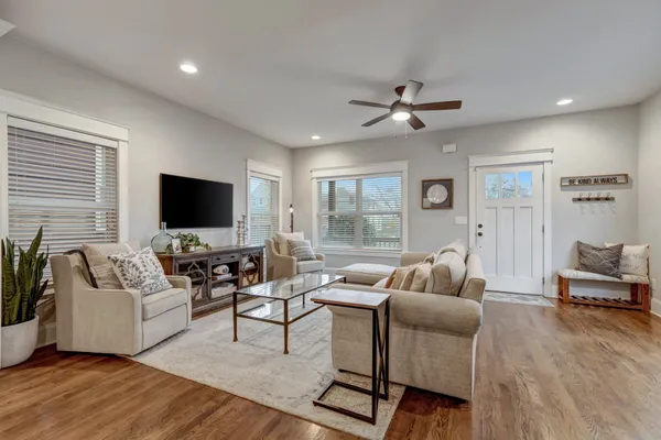 a living room with furniture and a flat screen tv