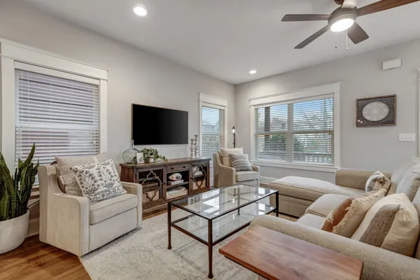 a living room with furniture and a flat screen tv