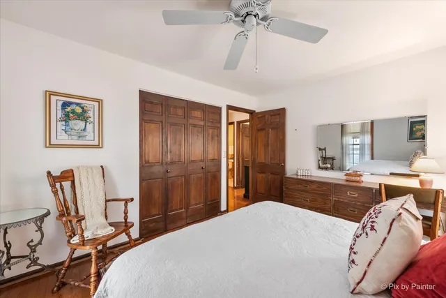 a bedroom with a bed and a chair