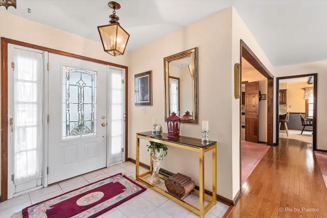 a workspace with wooden floor and windows