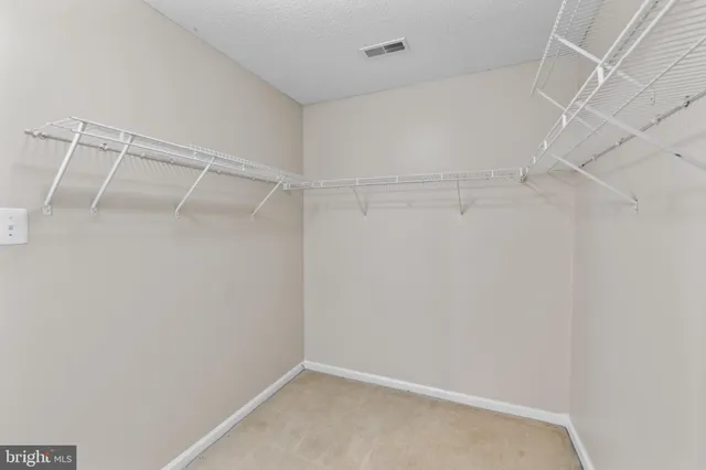 a view of an empty walk in closet