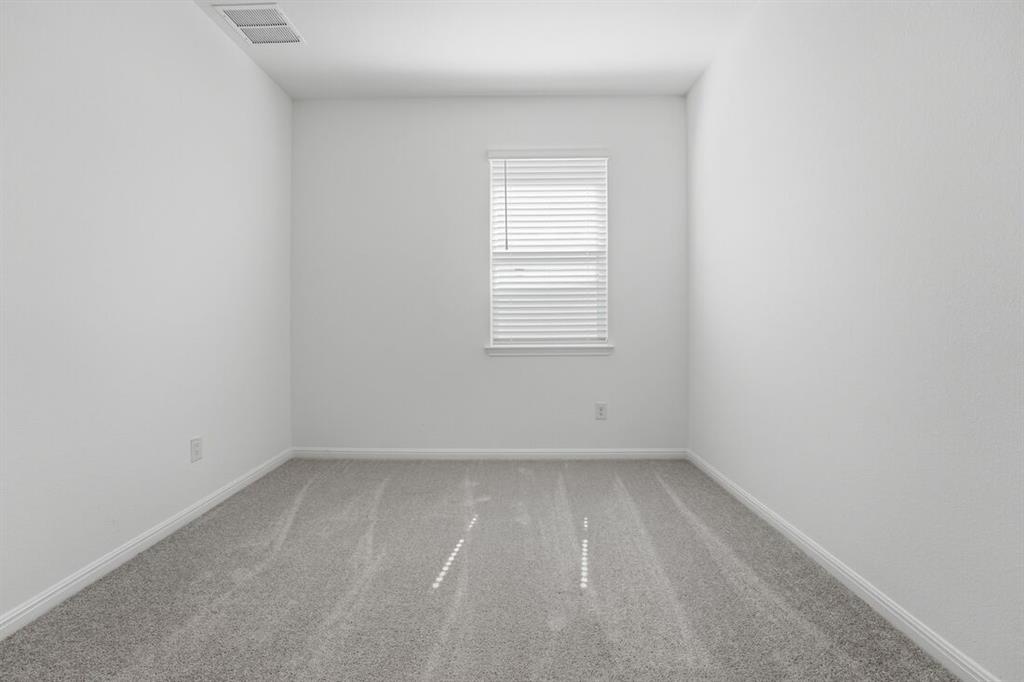 201 Betsy Road Hutto, TX 78634 - Photo 15 of 18 This room features a window with blinds, light gray carpet, and white walls