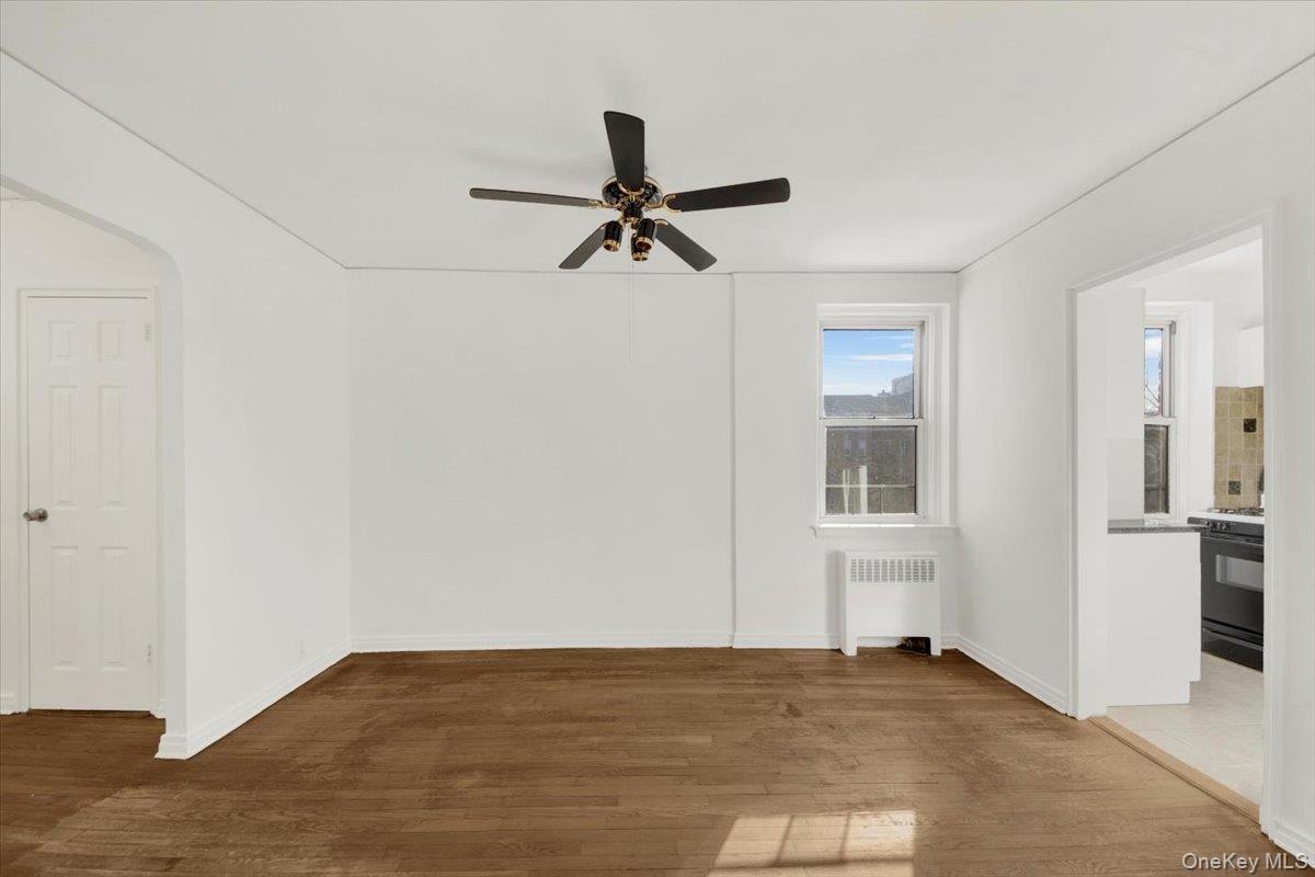 811 Bronx River Road, Unit 3C Bronxville, NY 10708 - Photo 12 of 27 a view of a livingroom with a ceiling fan & hardwood floor