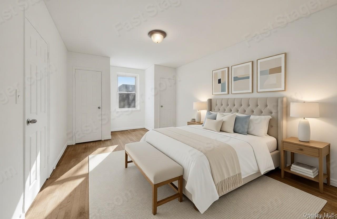 811 Bronx River Road, Unit 3C Bronxville, NY 10708 - Photo 2 of 27 a bedroom with a bed and a painting