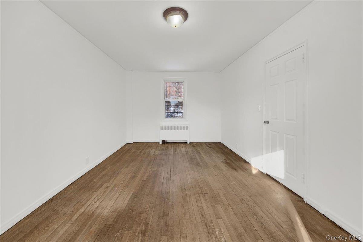 811 Bronx River Road, Unit 3C Bronxville, NY 10708 - Photo 21 of 27 a view of empty room with wooden floor