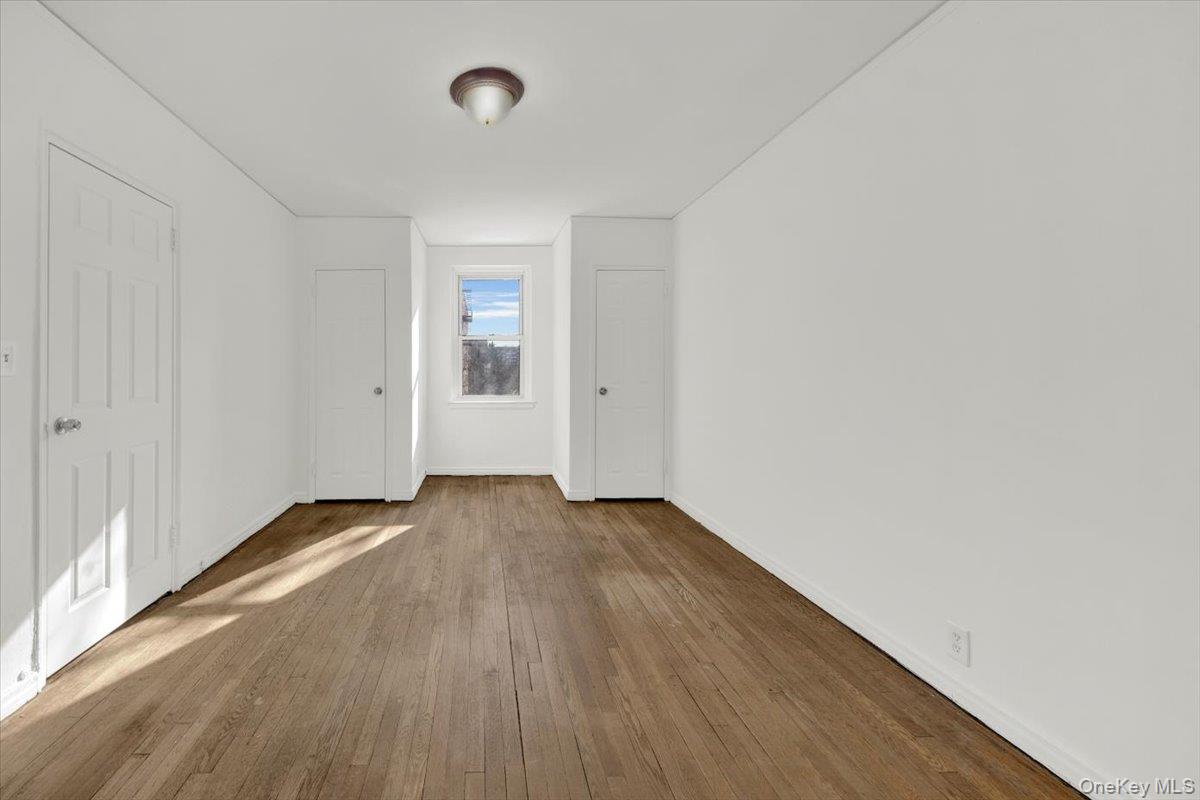 811 Bronx River Road, Unit 3C Bronxville, NY 10708 - Photo 22 of 27 a view of an empty room with wooden floor