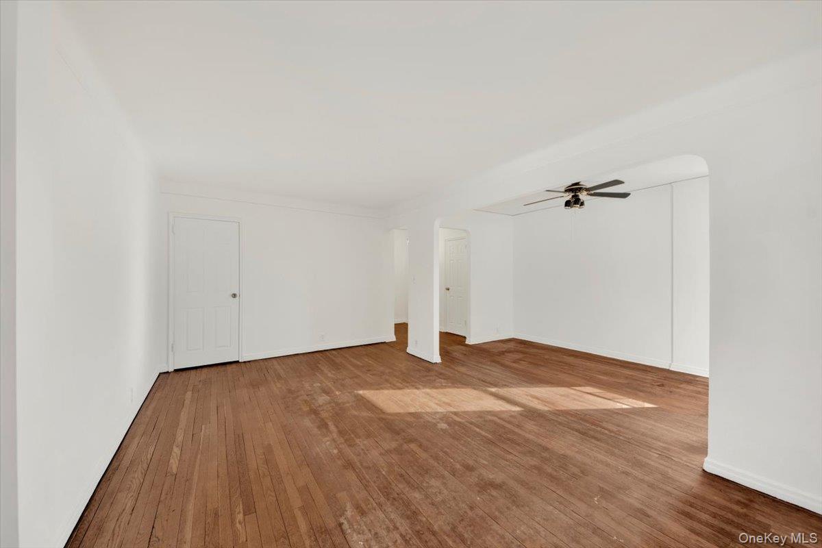 811 Bronx River Road, Unit 3C Bronxville, NY 10708 - Photo 9 of 27 a view of empty room with wooden floor