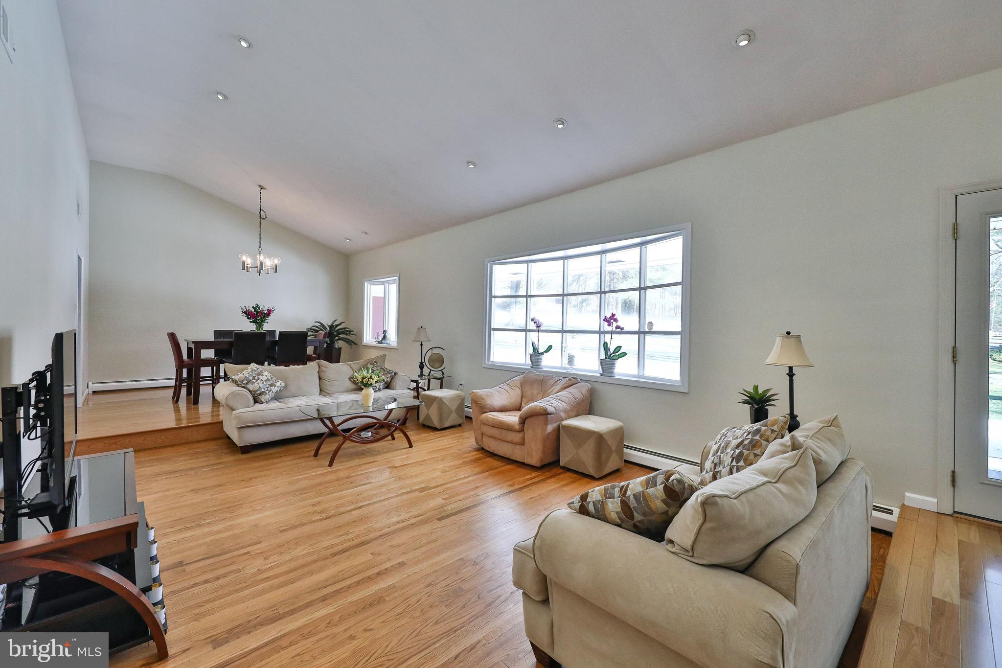 1700 Cary Road Huntingdon Valley, PA 19006 - Photo 2 of 52 Living Room and dining Room with vaulted ceiling.