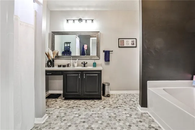 a bathroom with a sink and a bathtub