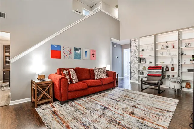 a living room with furniture or couch and a wooden floor