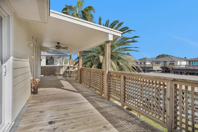 a balcony view with a seating space